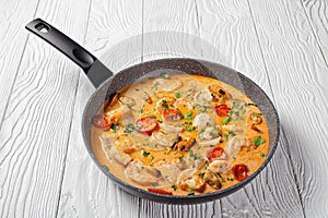 Seafood saute in a pan, top view