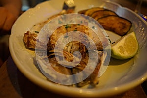 Seafood in sevilla Spain, lubina al horno photo