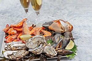 Seafood shellfish plate-Pink prawns, crab claws, Spanish mussels and oysters from Marennes Ol ron