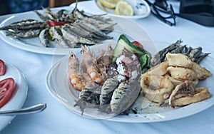 Seafood shrimps plate, tasty and freshly made mediterranean calamari and fish