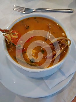 SEAFOOD SOUP IN TAZA BLANCA IN RESTAURANT photo