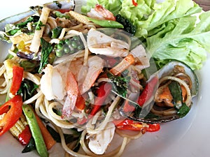 Seafood spaghetti and egg in spicy and herb sauce that are famous of Thailand Street food Menu