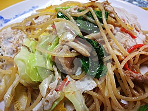 Seafood spaghetti and egg in spicy and herb sauce that are famous of Thailand Street food Menu