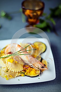 Seafood starter with prawns, ravioli and aubergine photo
