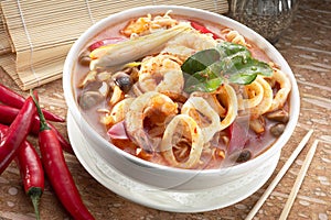 Seafood tomyam noodle soup photo