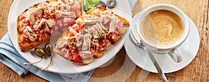 Seafood tostada topped with salsa and tuna photo