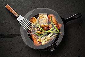 Seafood with veggies in a cast iron pot