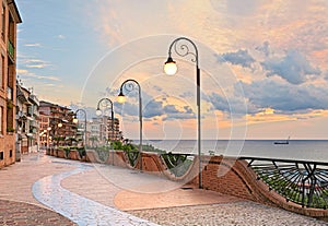 Seafront at dawn in Ortona, Abruzzo, Italy - beautiful terrace with street lamp on the Adriatic sea photo