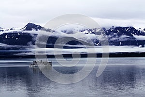 Seagoing Ship in a Cloudy Mountain Landscape