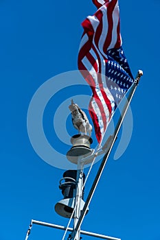 Seagul and tthe flag on a blue sky background