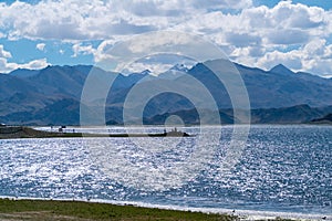 Beautiful scenery of Pangong Tso lake with  blue sky  white clouds in China side