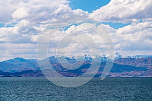 Beautiful scenery of Pangong Tso lake with  blue sky  white clouds in China side