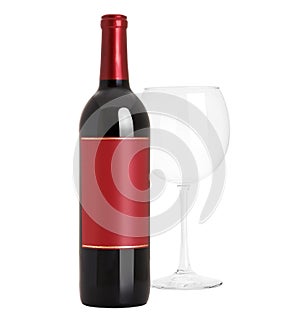 Sealed red wine bottle and glass