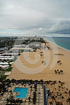 Sealine and sand beach with pool in Fort Lauderdale, USA