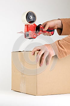 Sealing a box with packing tape