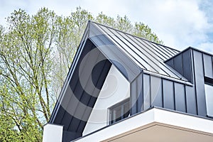 Seam metal roof with hidden eaves gutter photo