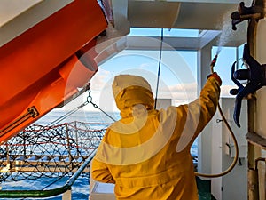 Seaman cleaning the ship.