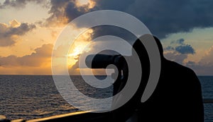 A seaman looks through binoculars