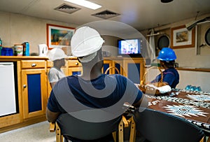 Seamen crew onboard a ship or vessel having fun watching TV