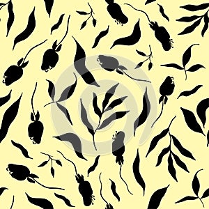 Seamless abstract black leaves of a Botanical pattern on a yellow background. Beautiful seamless pattern of flowers