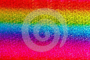 Seamless abstract glitter rainbow background of holographic paper