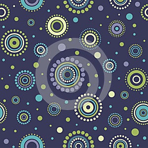 Seamless abstract pattern green, yellow and turquoise circles and dots on dark blue. Kaleidoscope background