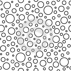 Seamless abstract pattern of little and big circles with black outline on white background. Foam bubbles