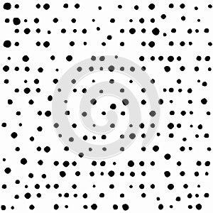 Seamless abstract pattern of little black shabby dots or spots on white