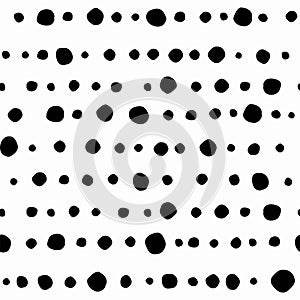 Seamless abstract pattern of little black shabby dots or spots on white