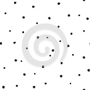 Seamless abstract pattern of little black shabby dots or spots on white
