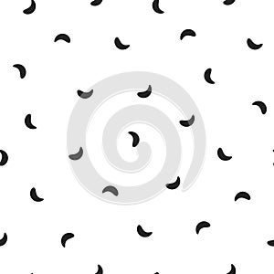 Seamless abstract pattern of little black shabby strokes or spots on white. Hand drawn, offhand style