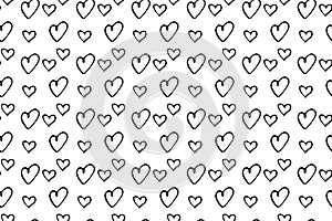Seamless abstract pattern of small black hearts. Hand drawn doodle background  texture for textile  wrapping paper  Valentines day