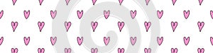 Seamless abstract pattern of small pink contour hearts. Hand drawn doodle background, texture for Valentine\'s day