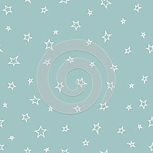 Seamless abstract pattern with white hand drawn stars of different rotation and size. Light green blue