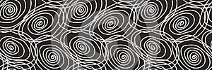Seamless abstract pattern with white spiral elements on dark background