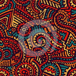 Seamless african pattern. Ethnic and tribal motifs. Orange, red, yellow, blue and black colors. Grunge texture. Vintage print for photo