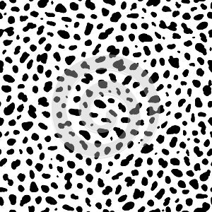 Seamless animal pattern. Imitation of skin of dalmatian dog. Black spots on white background