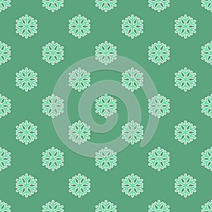 Seamless art pattern with snowflakes on blue green