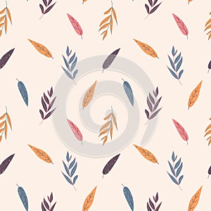 Seamless autumnal pattern of simple leaves on a beige background in warm palette.
