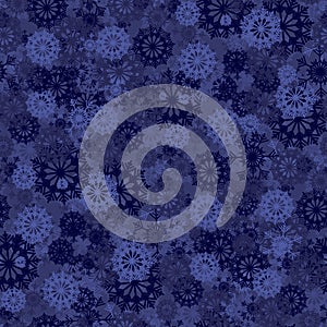 Seamless background with blue snowflakes for Christmas decorations