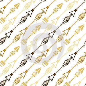 Seamless background of ethnic arrow in gold colors. Hand drawn arrows vector pattern.