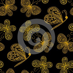 Seamless background with golden stylized butterflies on black background