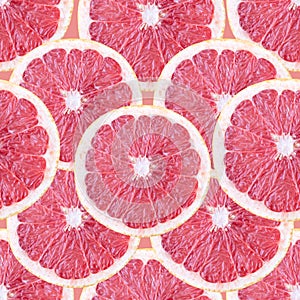 Seamless background with grapefruit slices