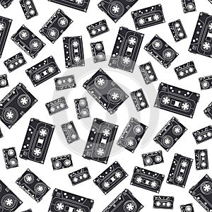 Seamless background pattern hipster style with audiocassette. Music. Sound. Retro. Magnetic tape. Analogue multimedia