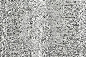 Seamless background texture of silver foil. shiny white surface. reflector