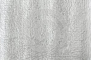 Seamless background texture of silver foil. shiny white surface. reflector