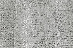 Seamless background texture of silver foil. shiny white surface. reflector