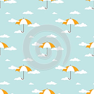 Seamless background with white clouds and orange umbrellas on powder blue sky