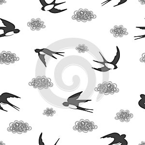 Seamless black and white pattern with flying swallows and clouds.