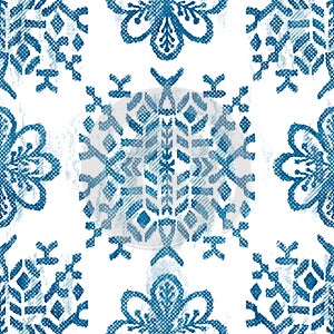 Seamless blue crosshatch tribal rug motif pattern.